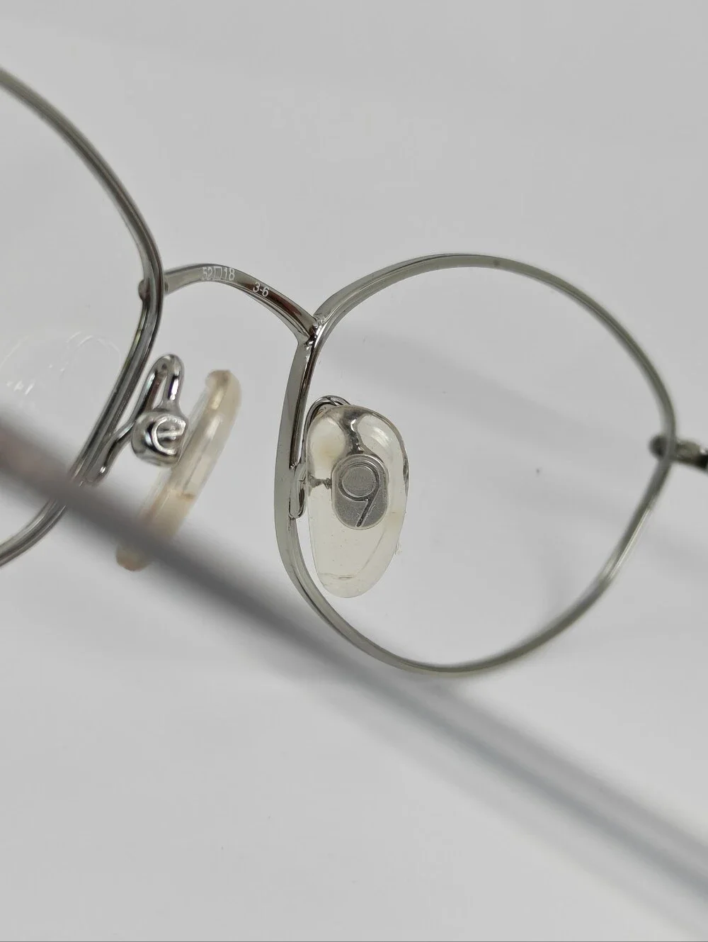 Nine West. 308. Silver Oval Wireframe. Ivory Grey Tortoise Front.